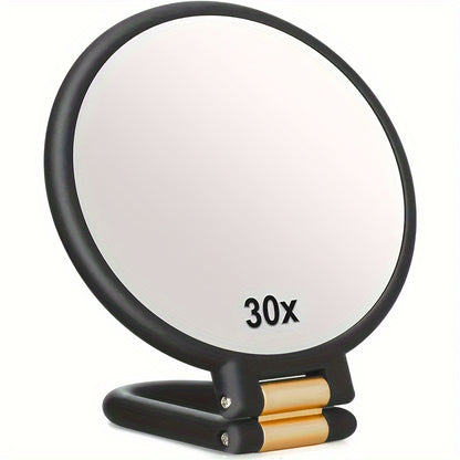 Espejo de maquillaje de mano de doble cara con aumento de 1X/30X y mango ajustable 360°. Diseño portátil y plegable para un cuidado preciso. Ideal para viajes. No necesita pilas. Marco negro con detalles dorados. Mini espejo.