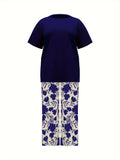 Plus Size Elegant Two-piece Set, Solid Crew Neck Short Sleeve Top & Floral Print Pants Outfits, Women's Plus Size Clothing